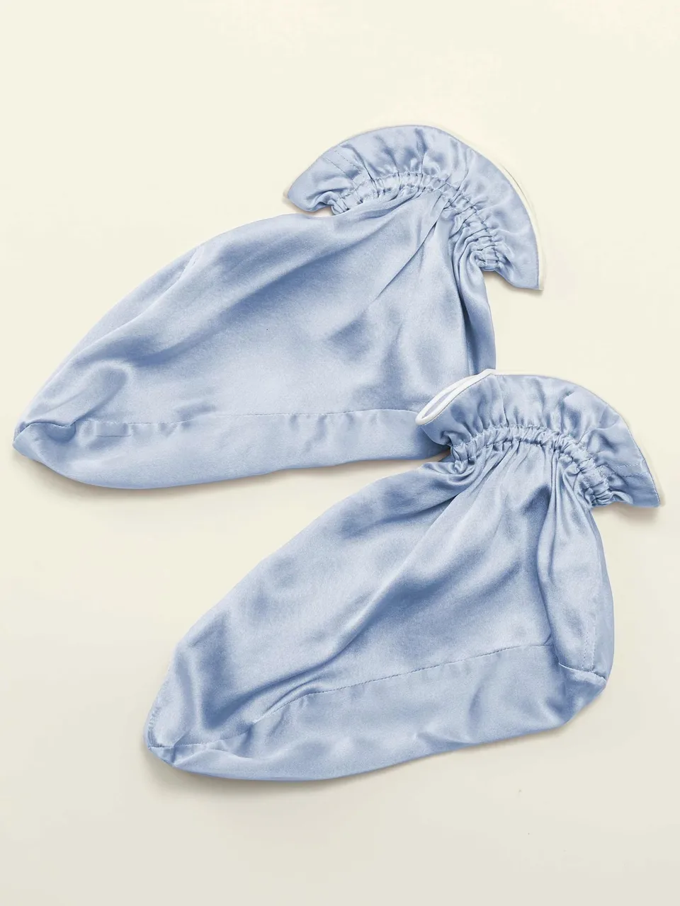 Mulberry Silk Sleep Foot Covers, on an oat backdrop